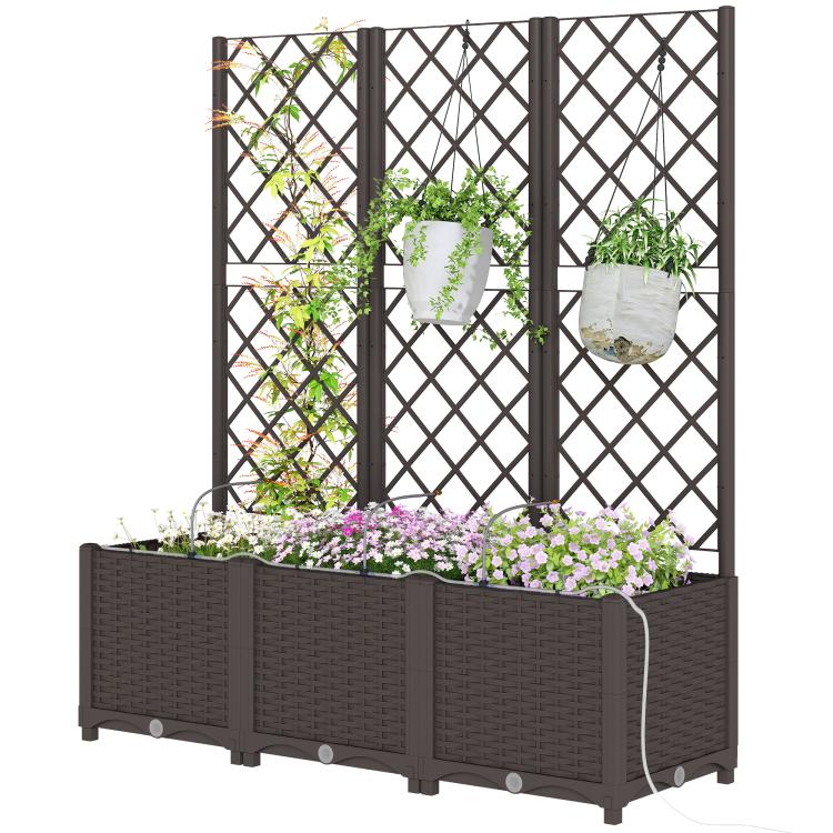 Raised garden planter with trellis panels and flowers, with attached irrigation timer