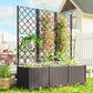 Raised garden planter bed with tall trellis and abundant pink flowers in outdoor yard
