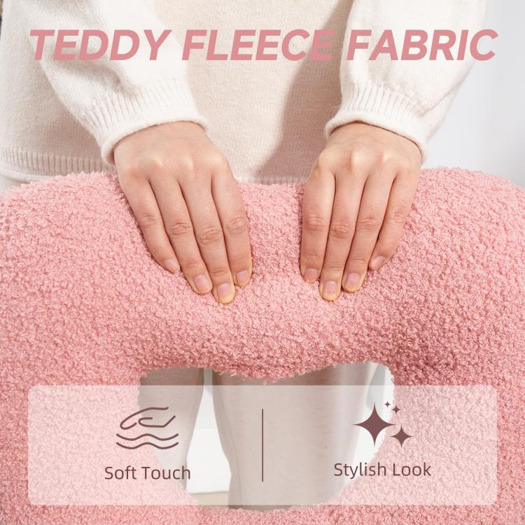Pink teddy fleece fabric with hands pressing the plush surface