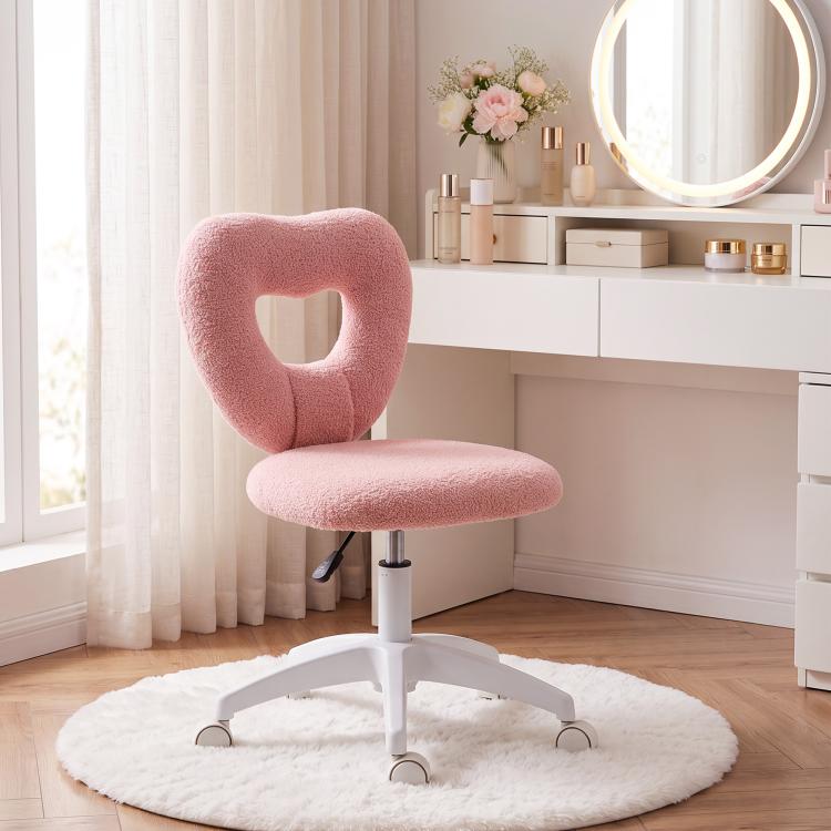 Pink teddy fleece armless swivel vanity chair with heart cutout back, round seat, and casters