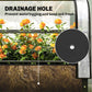 Clear greenhouse cover over raised bed showing drainage hole area and soil below