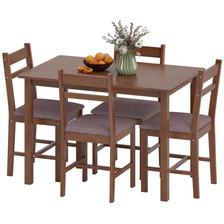 Light brown wood dining table set with four upholstered chairs, centerpiece on table