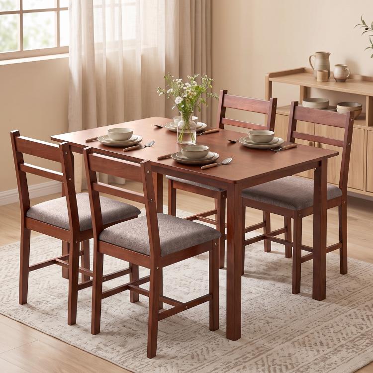 Light brown wood dining table set with four upholstered chairs for everyday dining