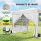 White pop-up canopy tent with sidewalls, stable base with stakes and sandbags