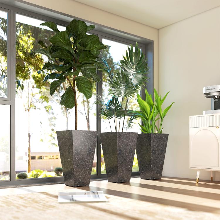 Three black tapered plastic planters with speckled marble finish