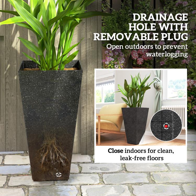 Black tall planter showing drainage hole with removable plug and plant in pot