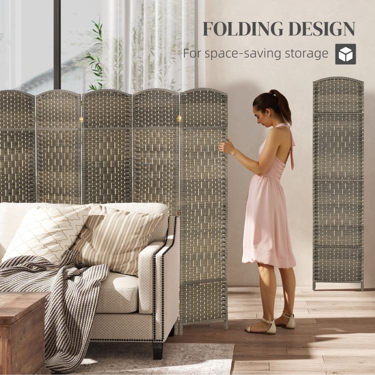 Folding privacy screen beside a person; woven dark rustic oak panels with arched top