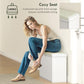 White shoe storage bench with thick padded seat cushion, shown seated for comfort