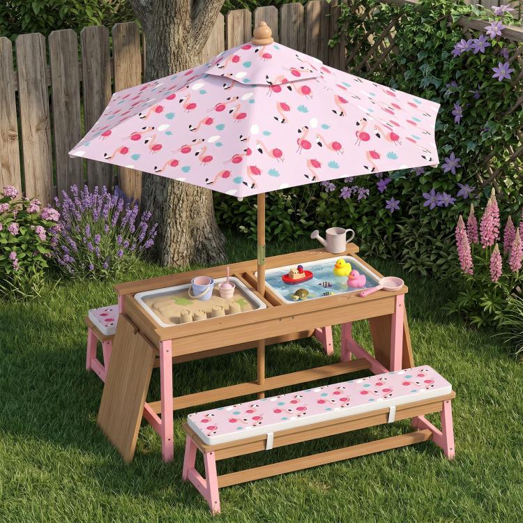 Kids picnic table set with flamingo-pattern umbrella, pink benches, and tabletop toys
