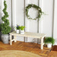 Light wood backless bench with slatted seat, two-seat length and open side supports