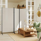 Indoor privacy divider with three light gray panels and black folding legs