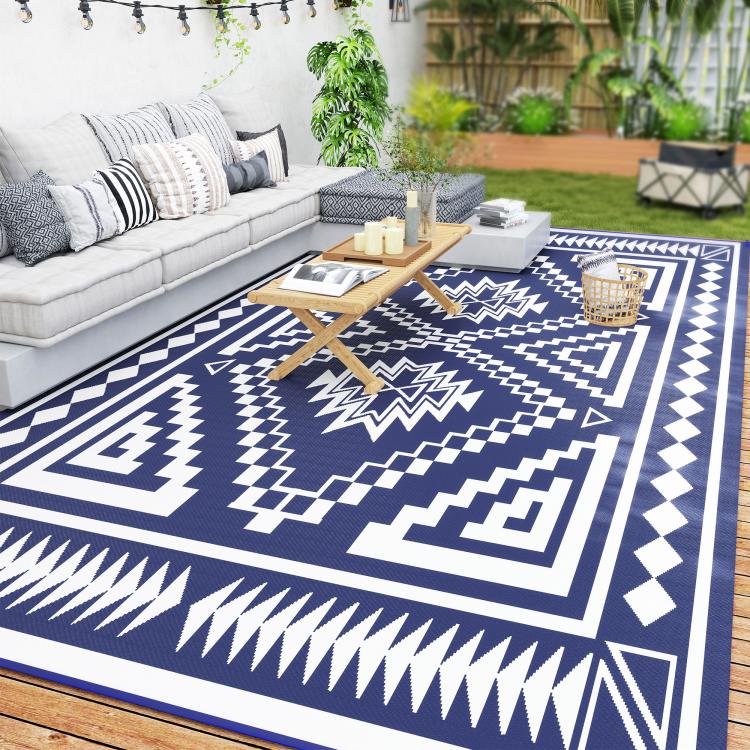 Outdoor rug with navy and white square geometric patchwork design