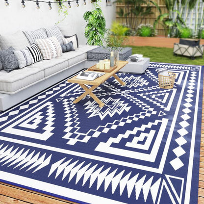 Outdoor rug with navy and white square geometric patchwork design