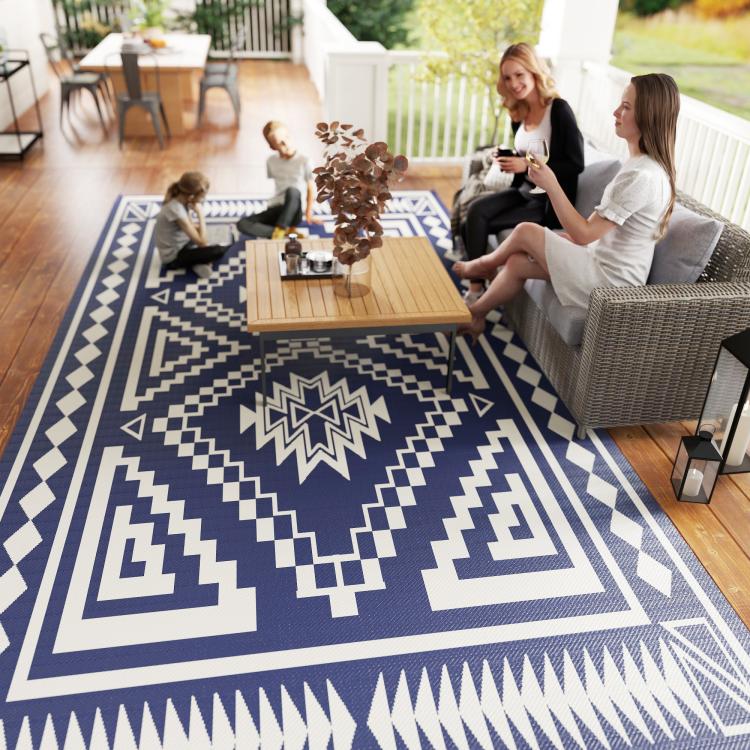 Reversible outdoor rug with blue and white geometric square patchwork