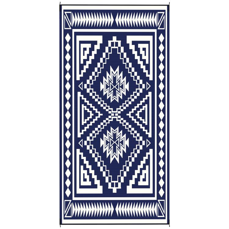 Reversible outdoor rug with navy and white geometric border and center diamonds