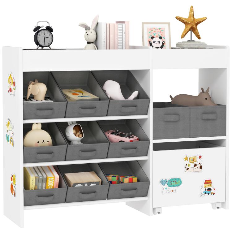 White kids toy storage cabinet with 11 gray fabric bins and open shelves for playthings