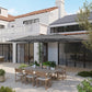 Gray patio parasol open over a modern outdoor dining terrace