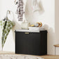 Black shoe storage bench with padded seat and flip drawer, cabinet doors closed