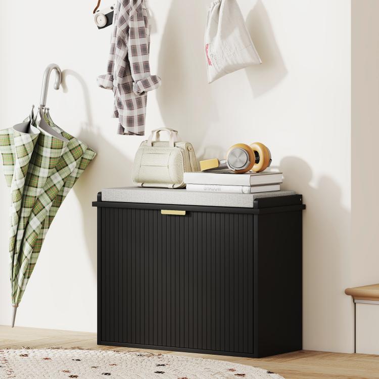 Black shoe storage bench with padded seat and flip drawer, cabinet doors closed