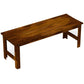 Backless wood patio bench with long slatted seat and sturdy legs, carbonized finish
