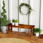 Backless wooden porch bench with slatted seat and dark brown finish