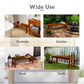 Backless wooden bench with slatted seat, dark brown, shown in outdoor settings