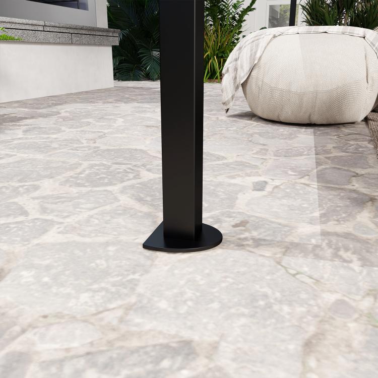 Dark metal gazebo base post standing on patio tile with canopy frame above