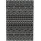 Outdoor geometric rug close-up with black and gray patterned bands