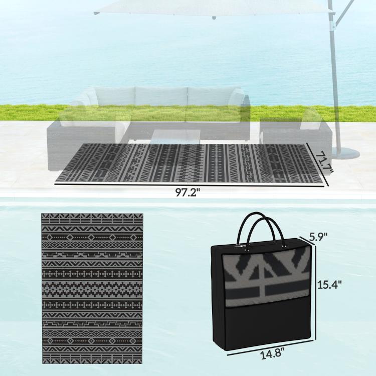 Folded outdoor rug with black/gray geometric print and carrying bag, size 6x9 ft shown