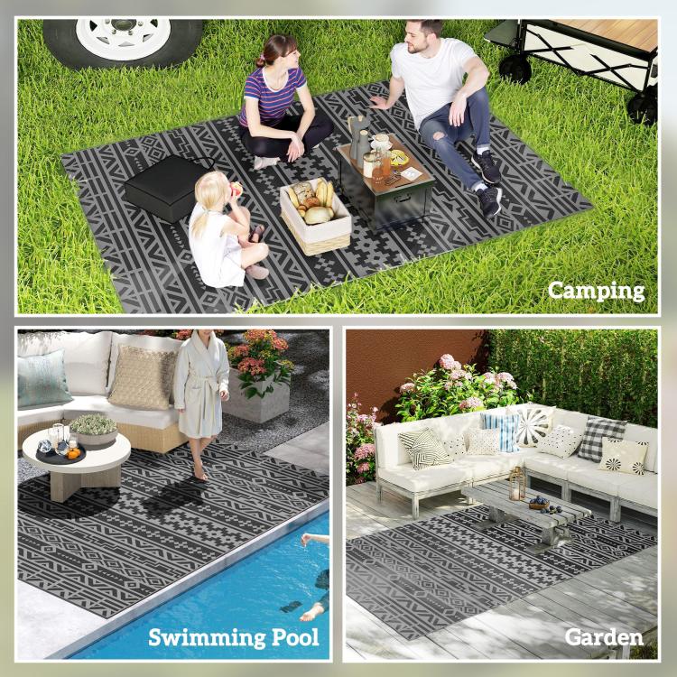 Black and gray geometric outdoor rug styled for camping, pool, and garden seating scenes