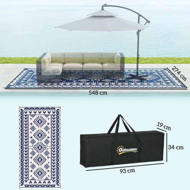 Blue-and-white patterned outdoor rug with included black carry bag