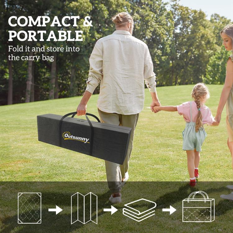 Black carry bag for a foldable blue-and-white outdoor rug