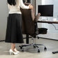 Dark brown office chair with flip-up armrest and padded seat, positioned near a desk