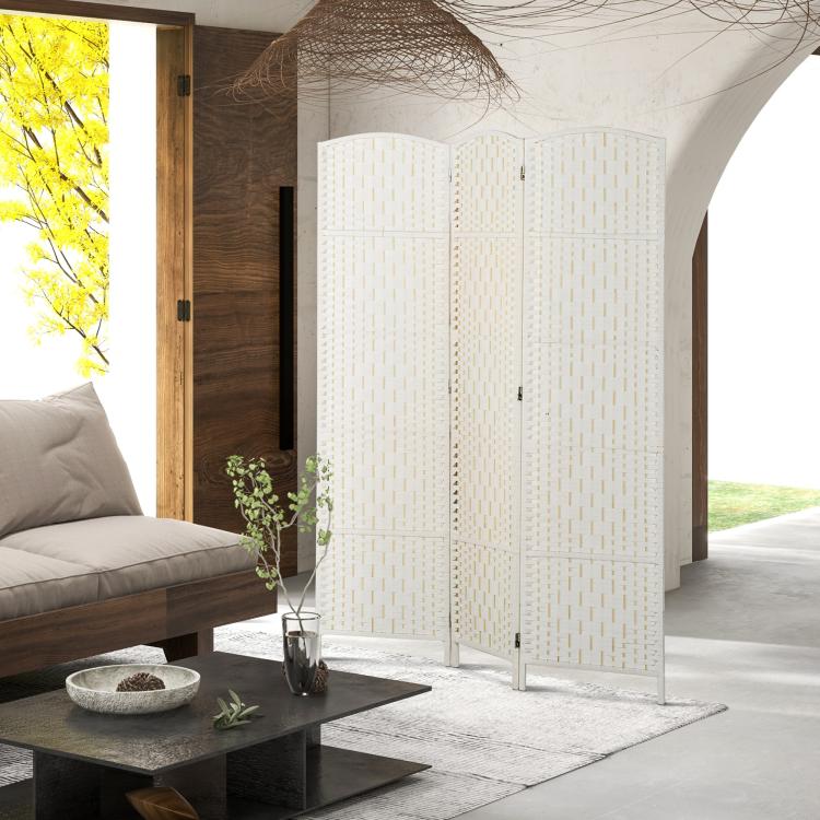 White woven 3-panel folding room divider near sofa, coffee table, and plant pot