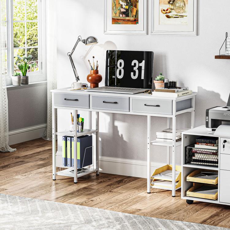 White office computer desk with three drawers and open shelving, clean tabletop