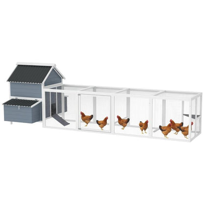 Light gray wooden chicken coop with enclosed run and nesting boxes, dark roof panels