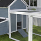 Light gray wooden chicken coop with mesh run and slanted wave roof