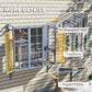 Gray window catio detail with slanted roof panel, two doors, and support frame