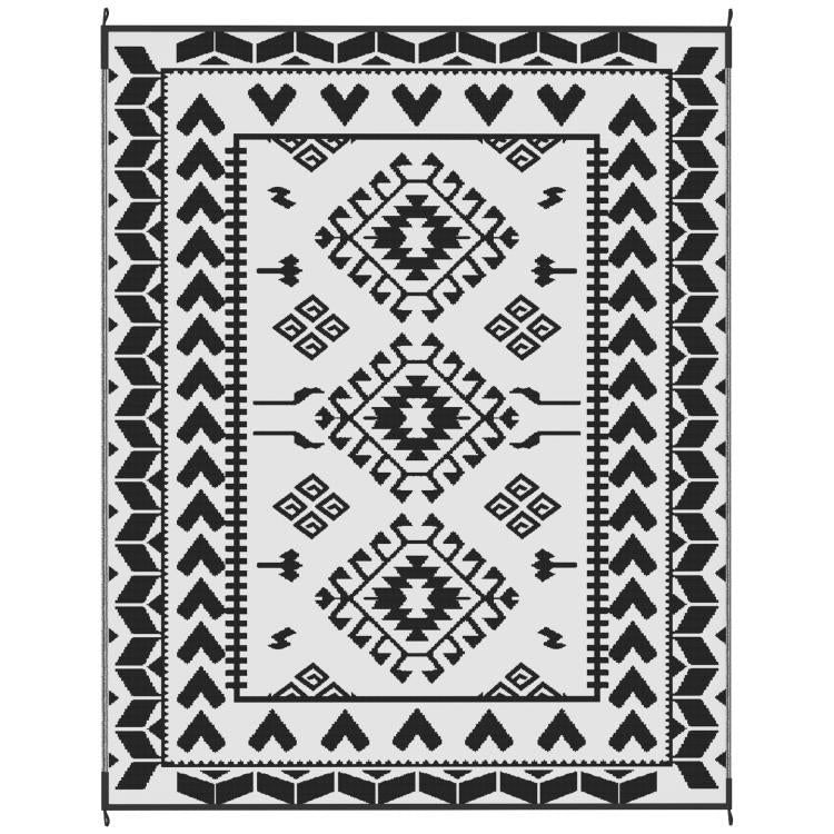 Outdoor rug flat lay showing black and white tribal geometric pattern