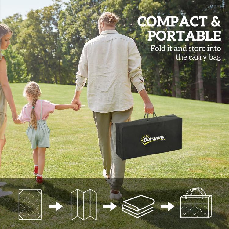 Outdoor reversible rug being carried in a black bag