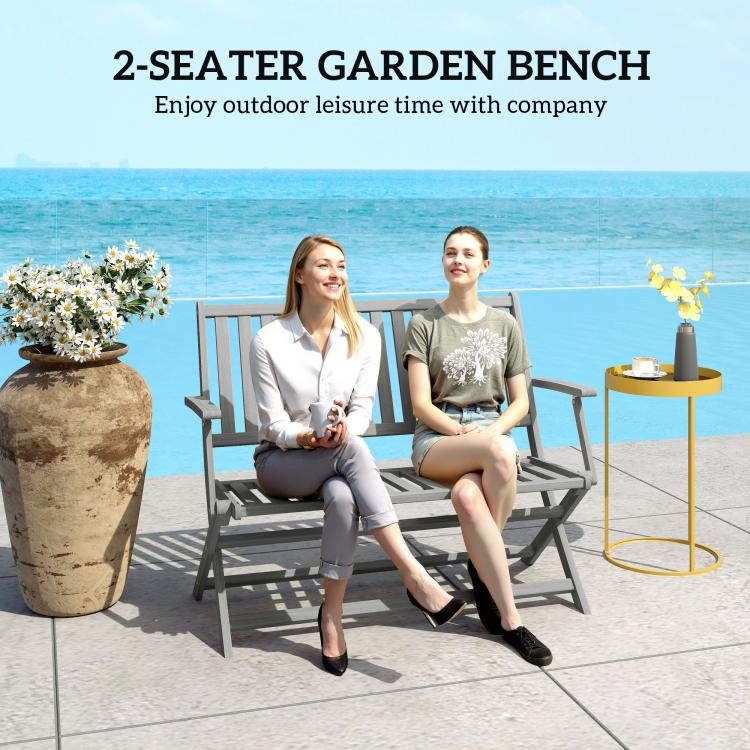 Gray two-seater garden bench with slatted seat and backrest for outdoor lounging