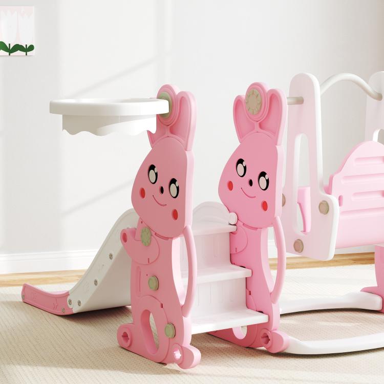 Pink rabbit-themed toddler slide and swing playset with climber, basketball hoop