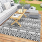 Black-and-white geometric outdoor rug with border and zigzag motif