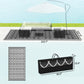 Reversible outdoor rug laid flat with black-and-white clover lattice pattern