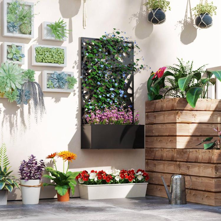 Black metal raised planter box with privacy screen and assorted flowering plants