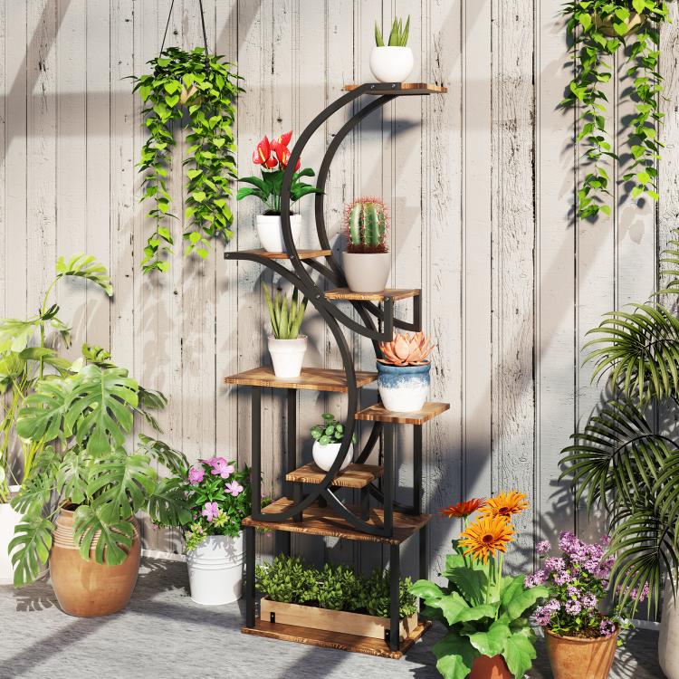 Tall S-shaped plant stand with black metal supports and warm wood shelves