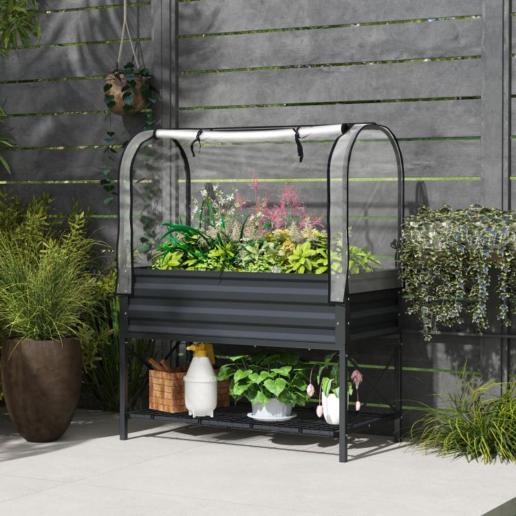 Dark gray metal elevated planter with clear cover on legs and lower storage shelf