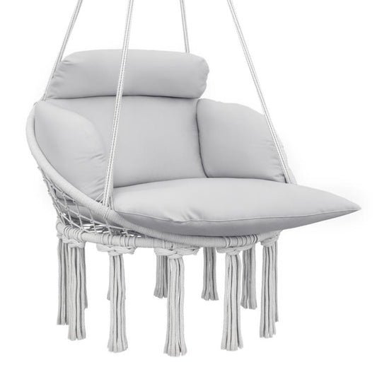 Gray macrame hanging hammock chair with large padded seat cushion and fringe tassels