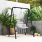 Gray macrame hammock chair with padded cushion and fringe tassels on black steel stand