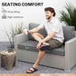 Gray outdoor loveseat cushions on a wicker bench, thick seat and two backs